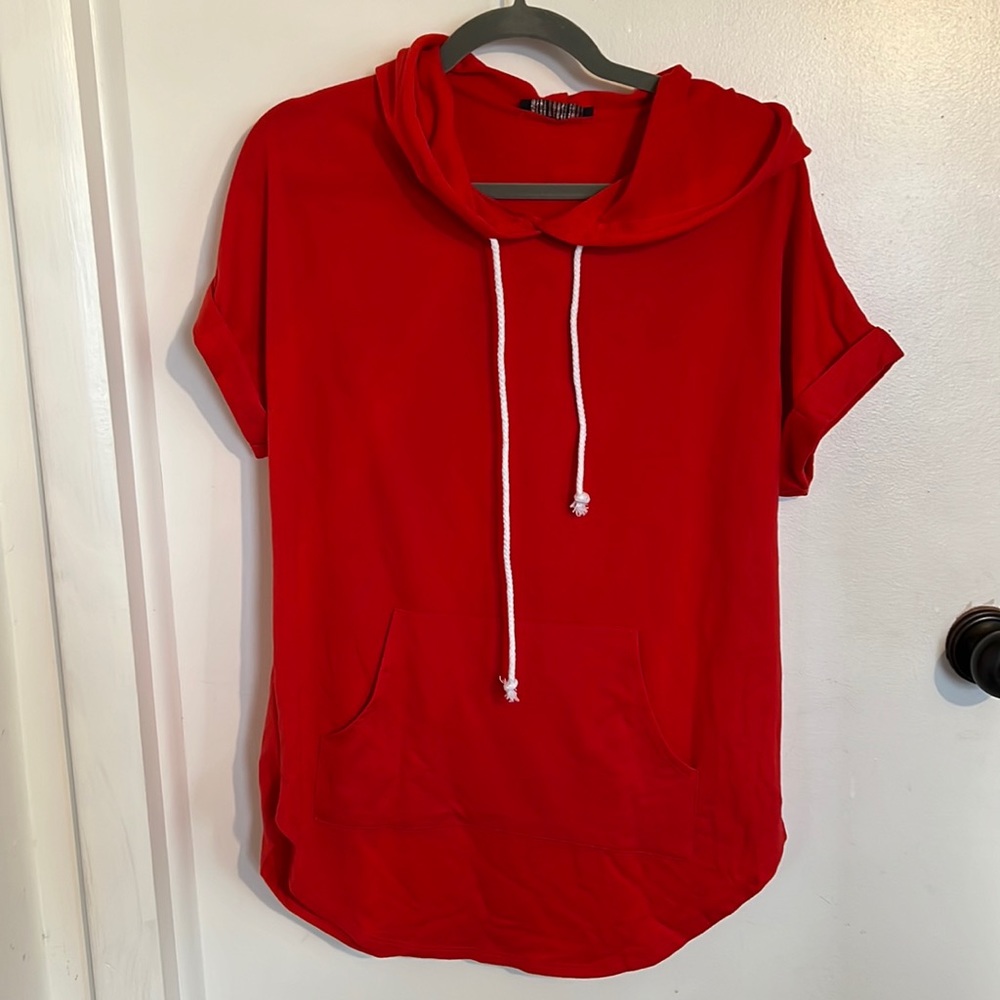Red tunic style short sleeve. Size medium. New, no tag.